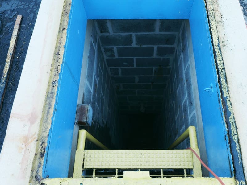 Blue-painted stairwell descending into the underground missile magazine
