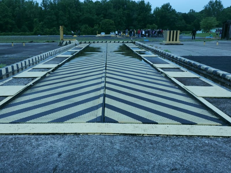 Black-and-yellow striped missile elevator deck at ground level