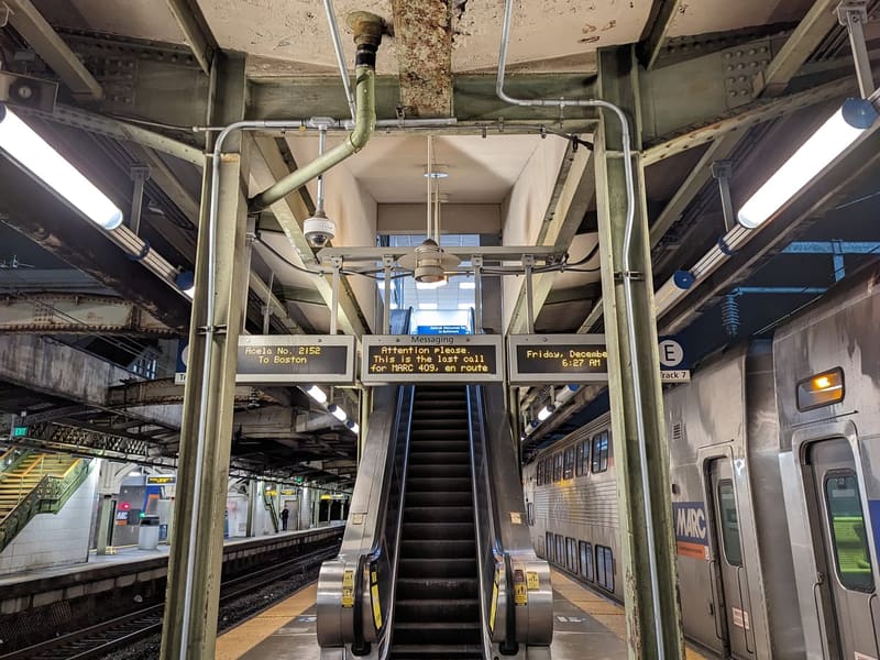 Symmetrical view of the escalator and platforms inside Baltimore Penn Station