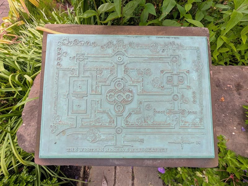 A weathered bronze plaque mapping the Western Reserve Herb Society garden