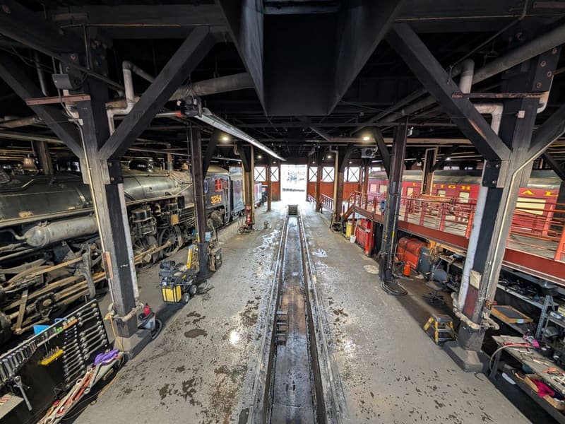 Interior of the Steamtown roundhouse, locomotives flanking a central track