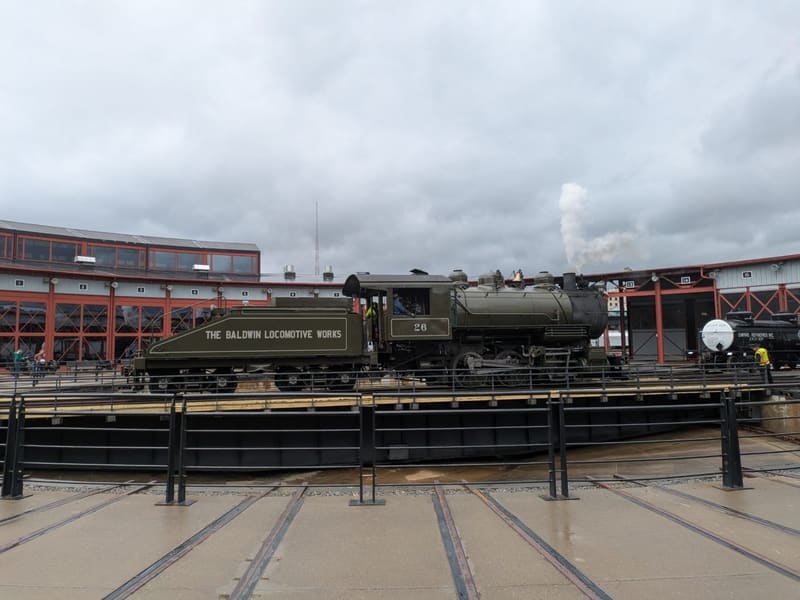 Baldwin Locomotive Works No. 26 on the turntable before the Steamtown roundhouse