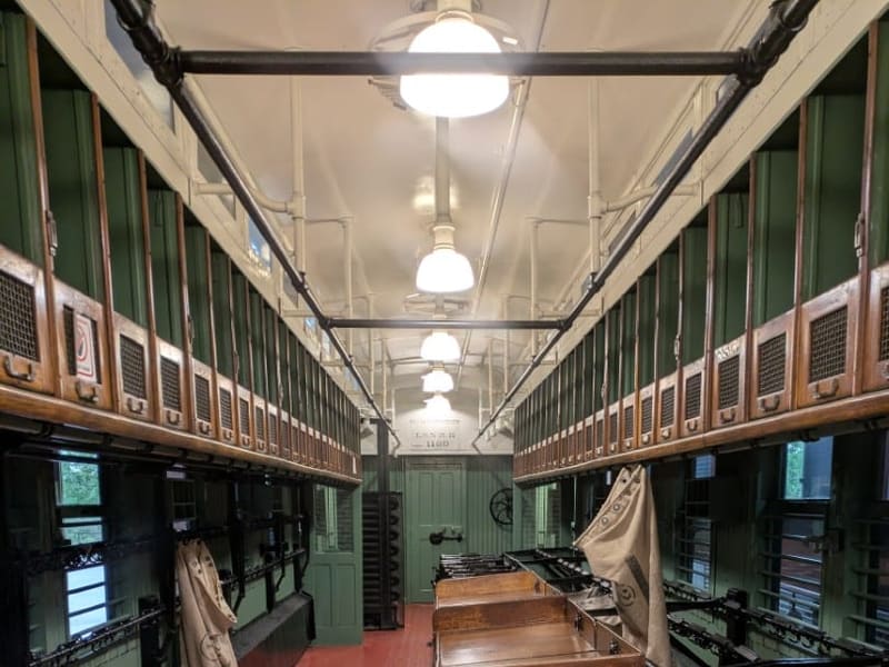Interior of a Railway Post Office car with sorting racks and mail catcher arms