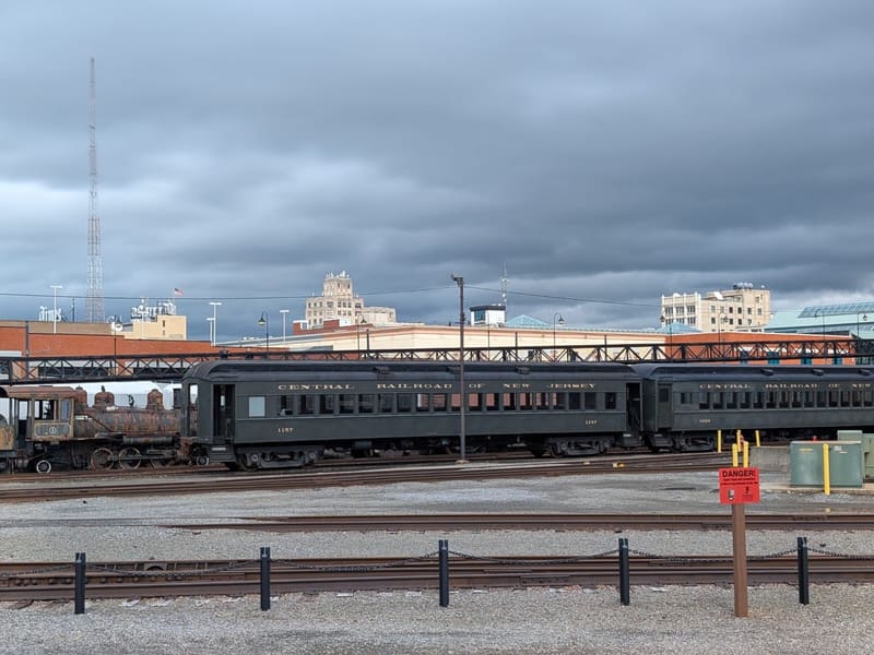 Central Railroad of New Jersey passenger cars in the Steamtown yard under a gray sky