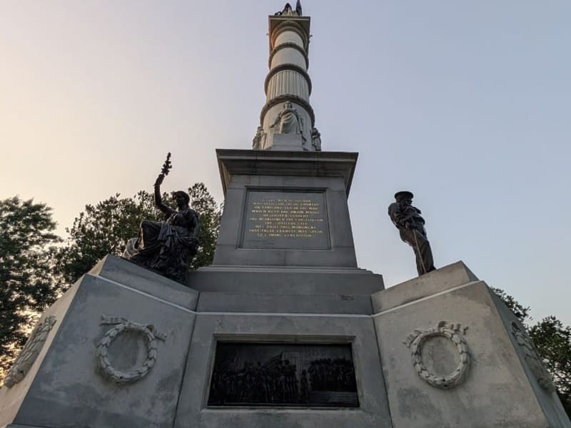 The Soldiers and Sailors Monument on Boston Common against an evening sky
