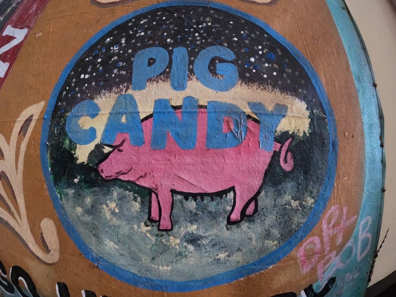 A hand-painted 'Pig Candy' folk-art sign by Dr. Bob, New Orleans