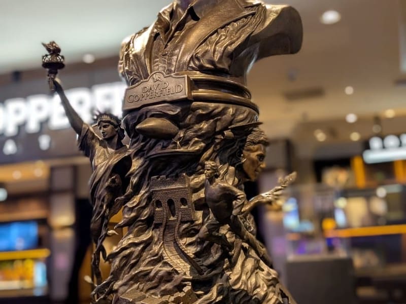 A bronze statue of magician David Copperfield holding a torch at the MGM Grand