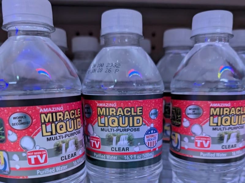 Novelty 'Miracle Liquid' bottled water gag products on a store shelf