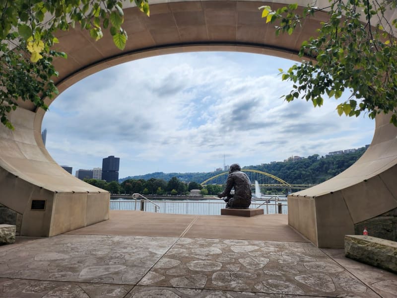 The Mr. Rogers memorial arch framing the Fort Pitt Bridge and Mount Washington