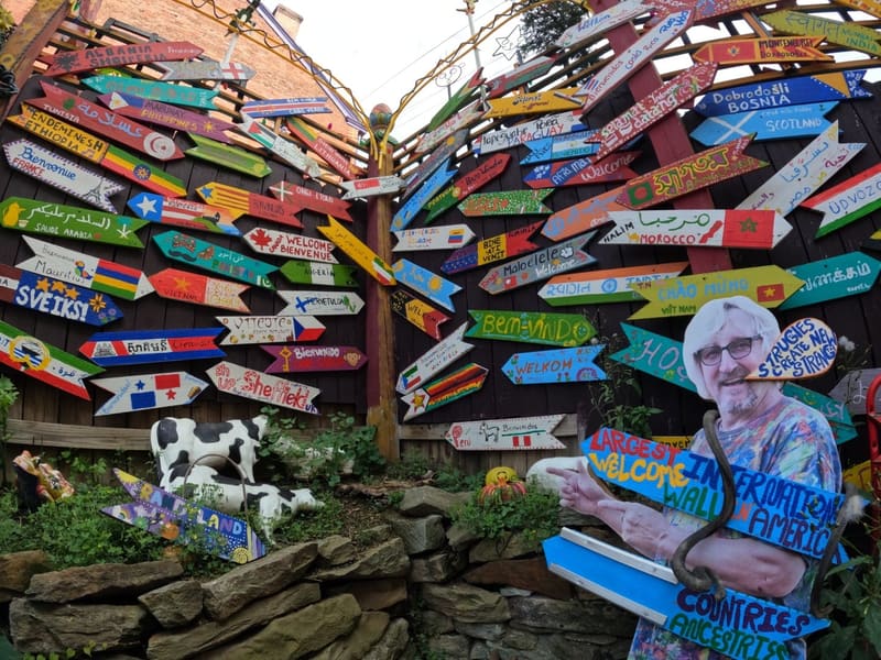 Randyland's wall of hand-painted welcome arrows in dozens of languages
