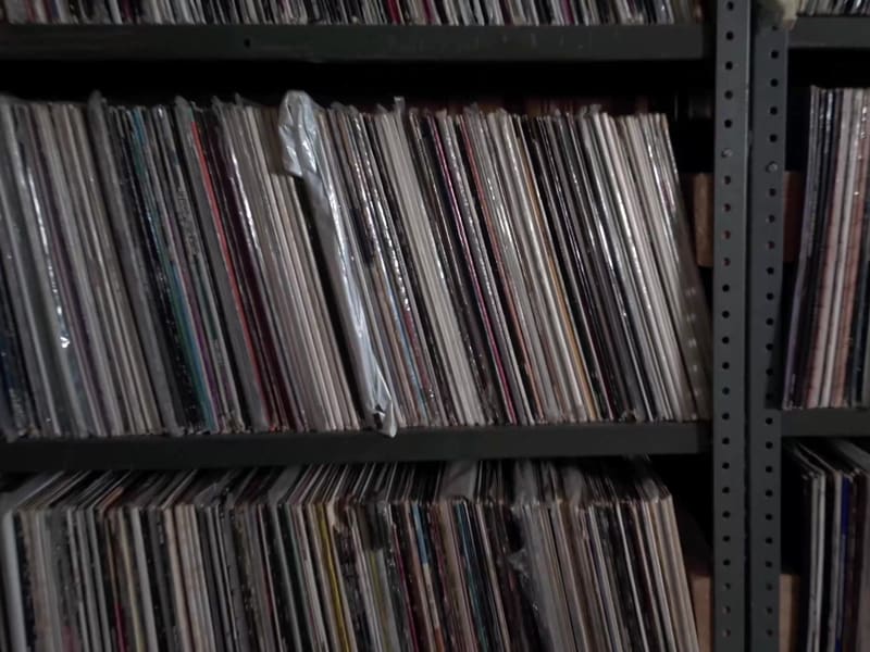 Mixtape gameplay: a hand working the controls of a reel-to-reel tape deck.
