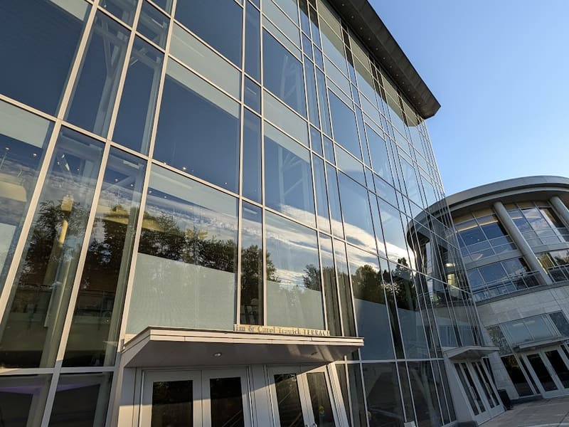 The Strathmore's curved glass-and-steel facade reflecting the evening sky.