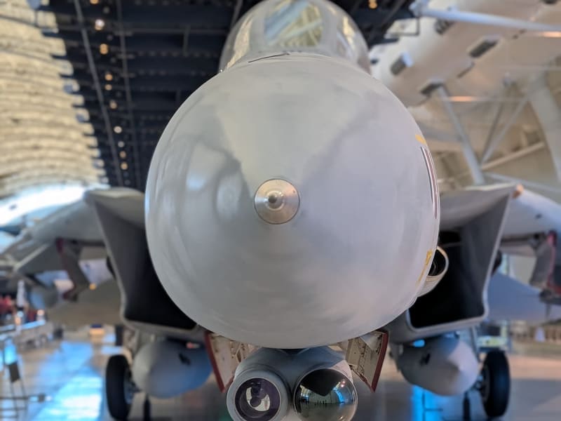 Head-on nose view of a grey U.S. Navy F-14 Tomcat fighter jet