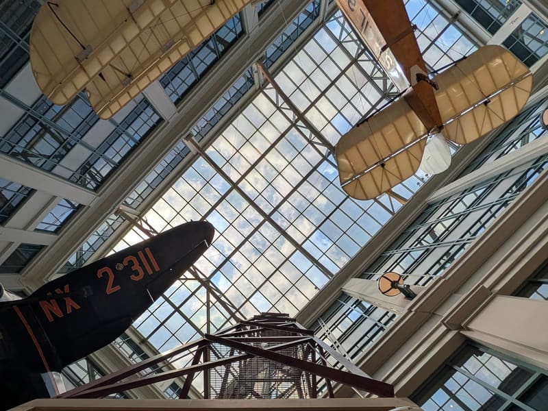 Mail airplanes hanging beneath the museum's glass atrium roof